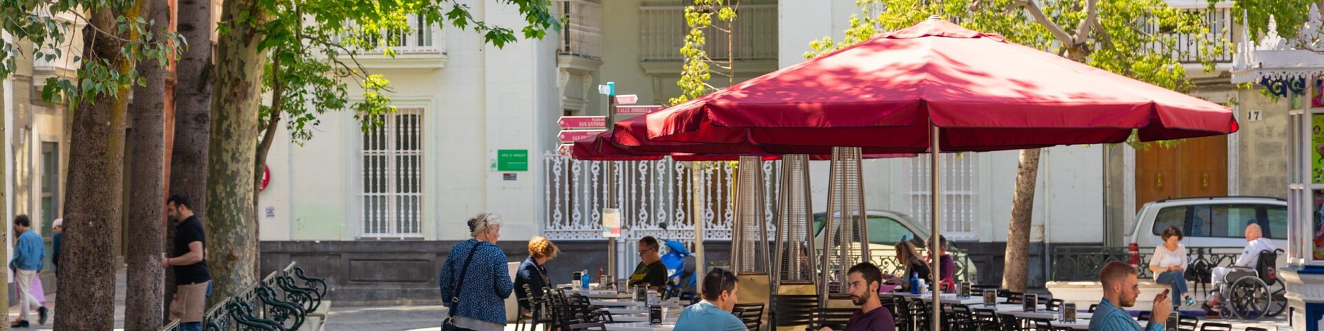 Plaza de Mina which includes outdoor eating as well as a small group of people