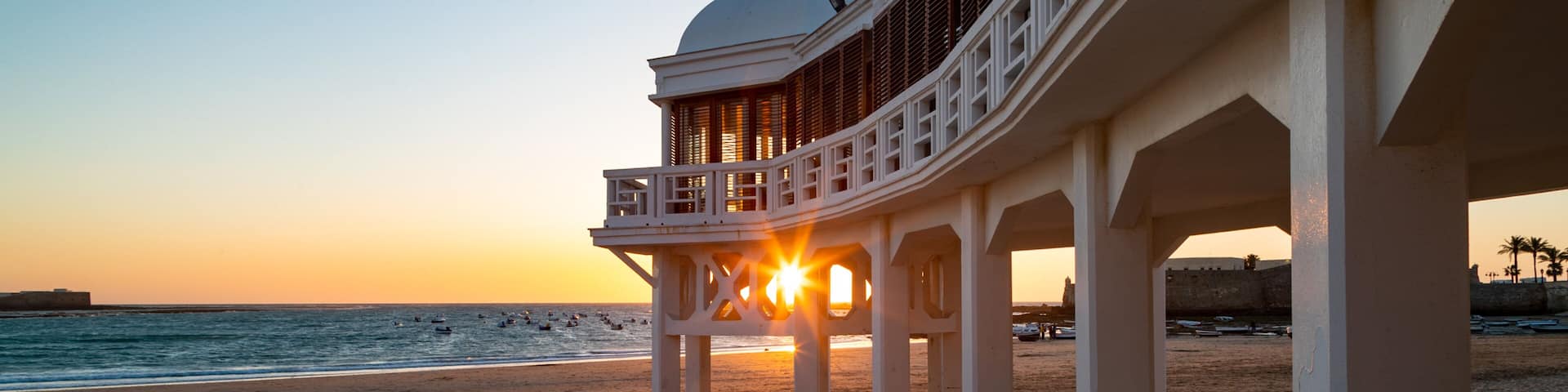La Caleta Beach featuring a sunset, a beach and general coastal views