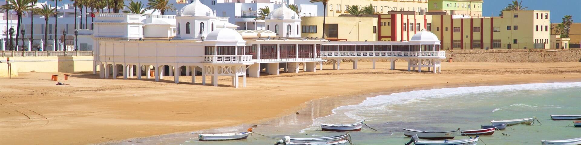 La Caleta Strand mit einem Sandstrand, Bootfahren und Bucht oder Hafen