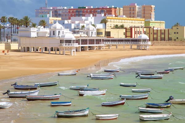 La Caleta Strand mit einem Sandstrand, Bootfahren und Bucht oder Hafen