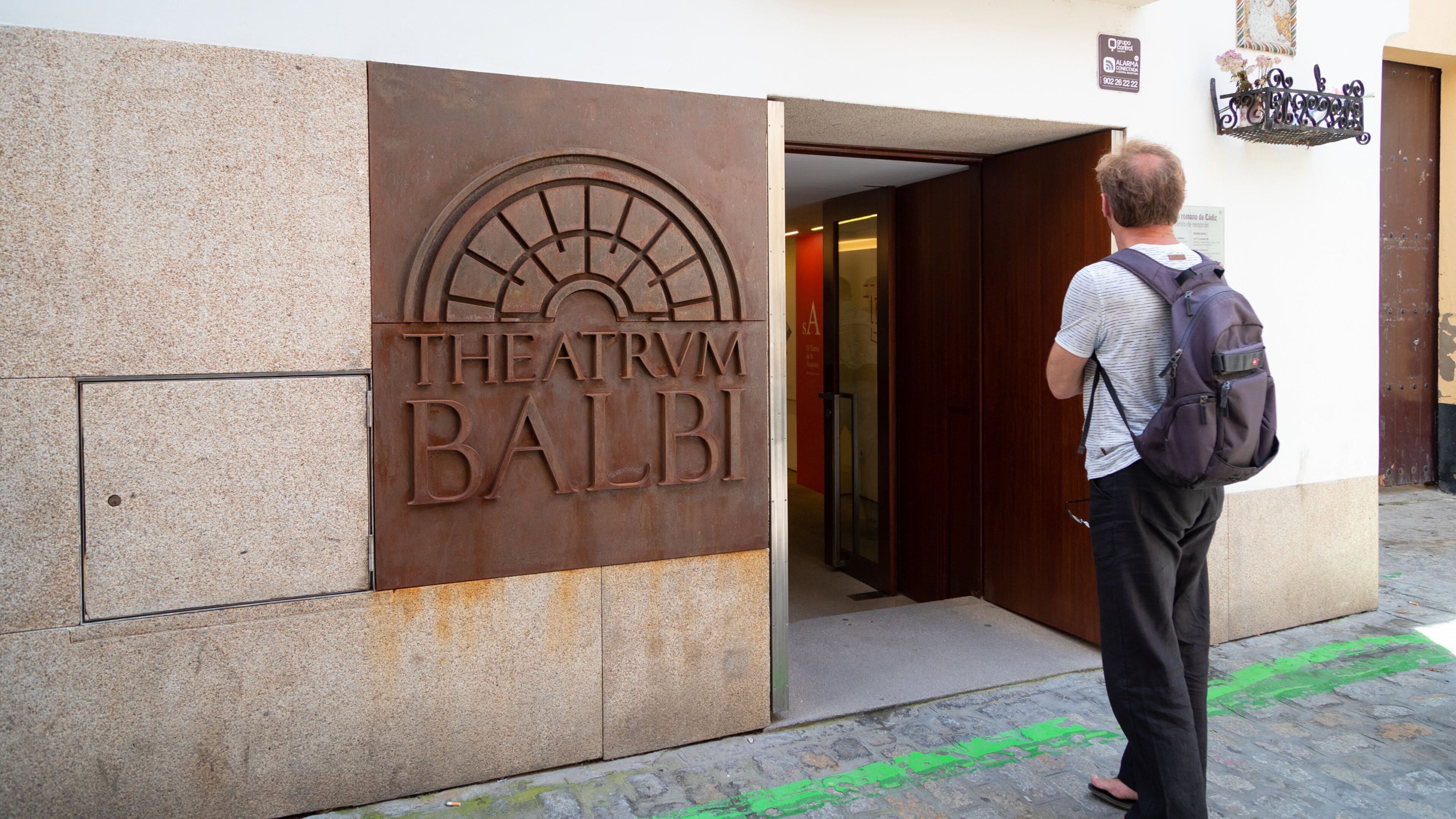 Roman Theater featuring street scenes and signage as well as an individual male