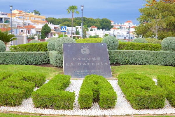 La Bateria Park showing signage and a garden