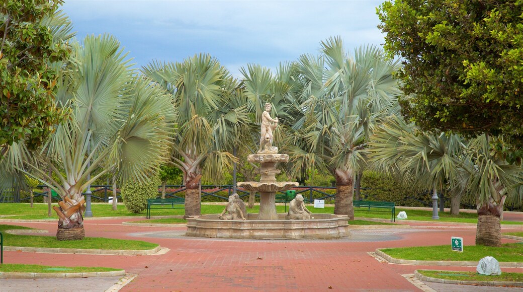 La Bateria Park which includes a garden, a fountain and tropical scenes