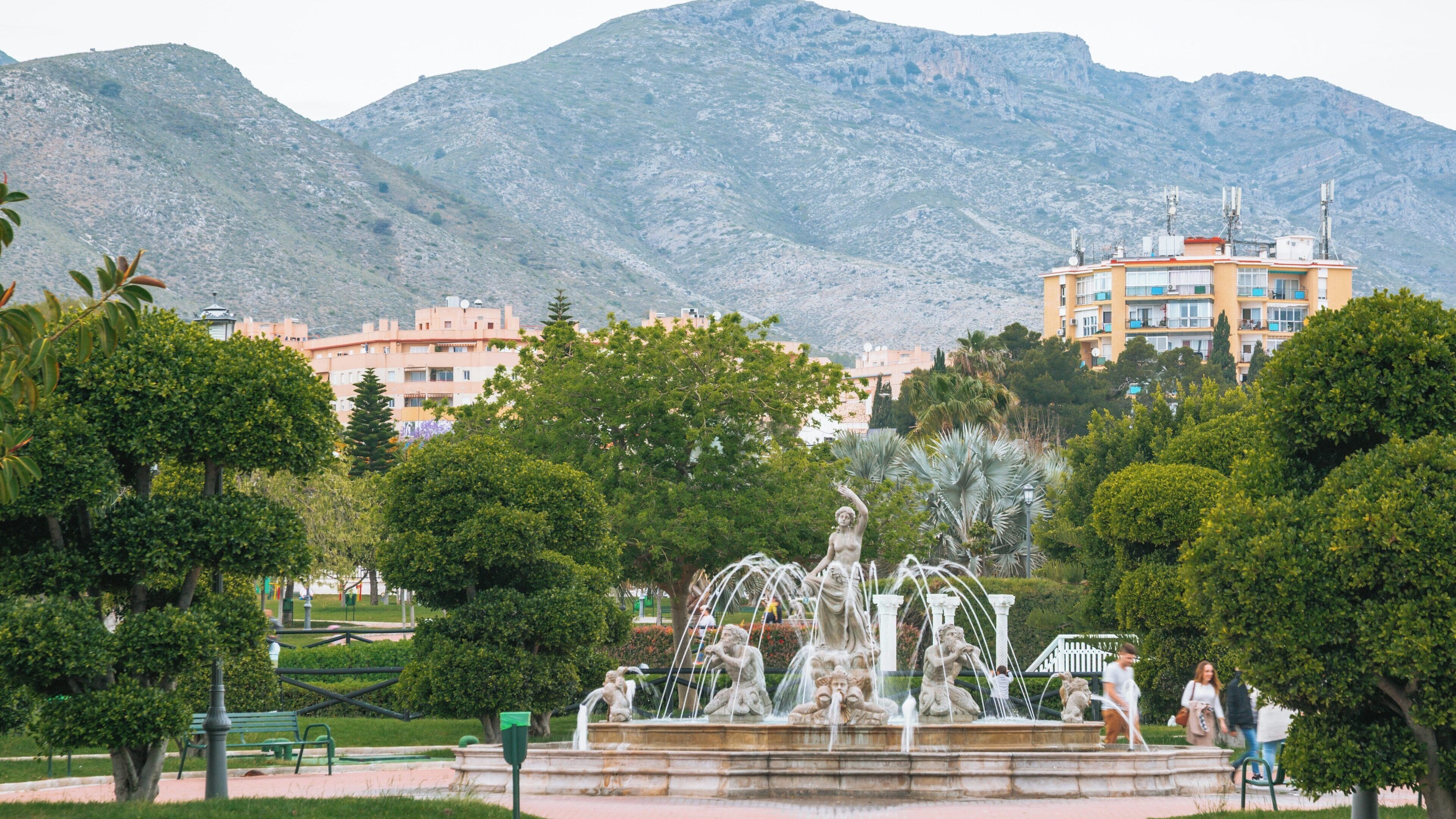 Beautiful La Bateria Park in Carihuela, Torremolinos, Andalusia, featuring a stunning fountain and surrounded by lush greenery