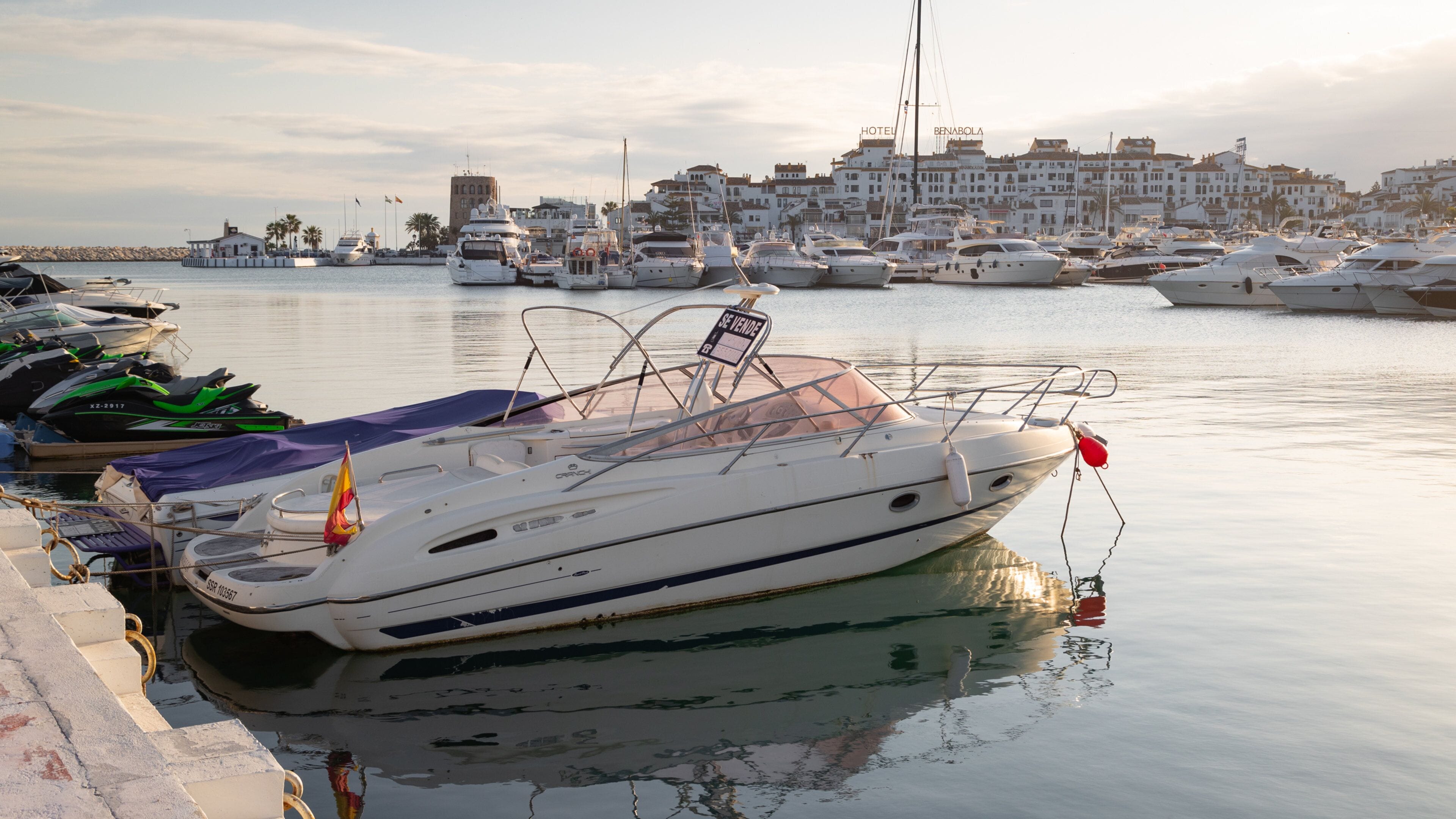 Puerto Banus Marina showing a sunset and a bay or harbor