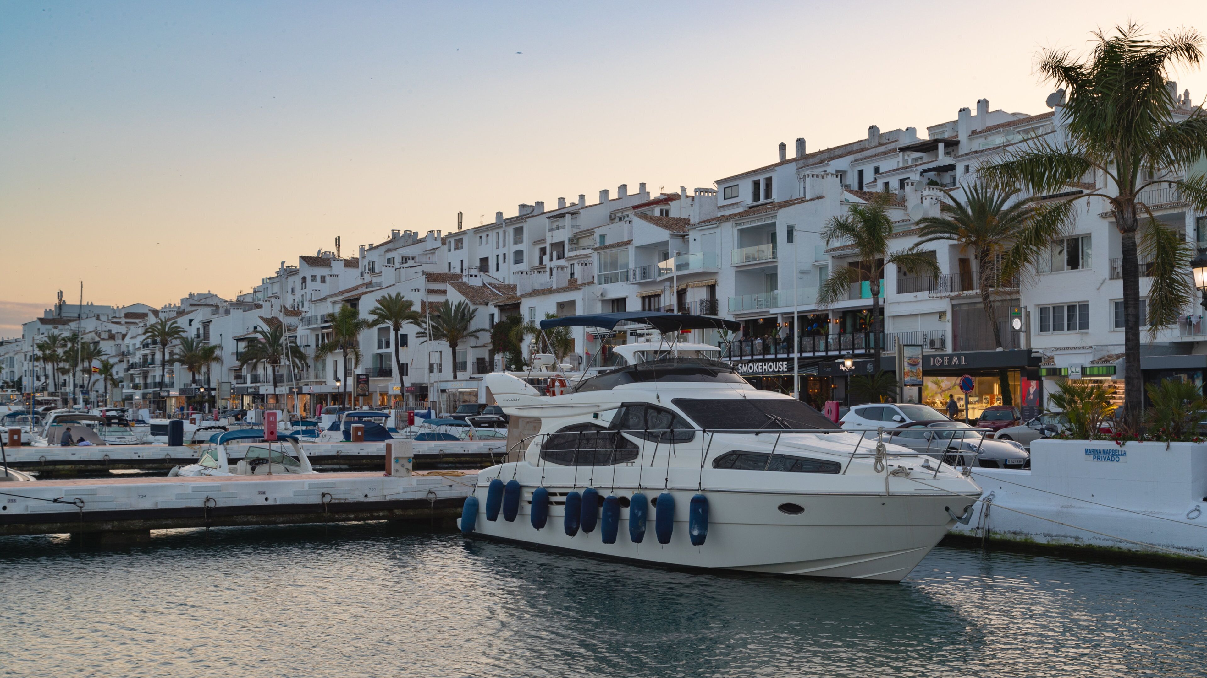 Puerto Banus Marina which includes a sunset and a bay or harbor