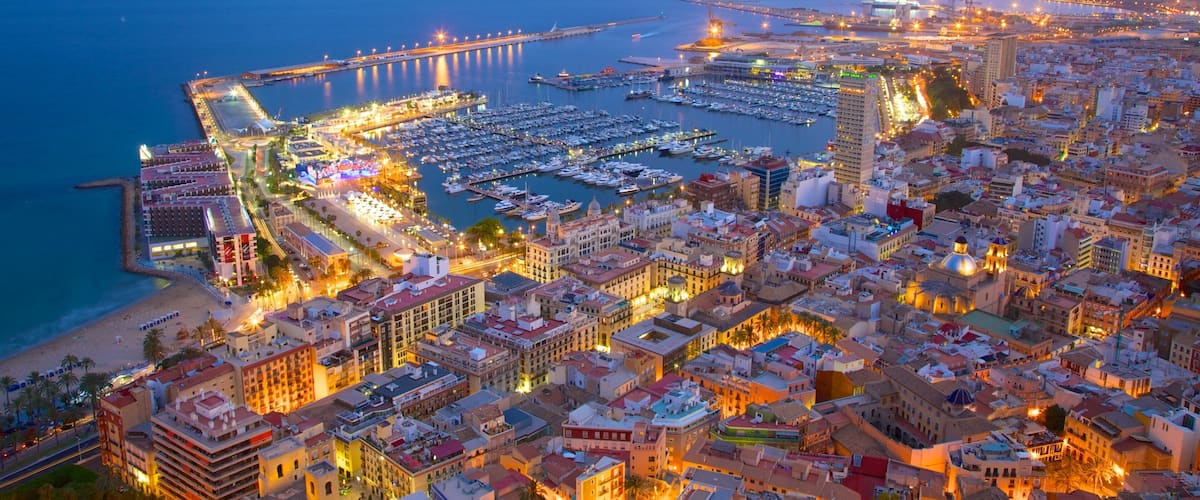 Castle of Santa Barbara featuring a city, night scenes and general coastal views