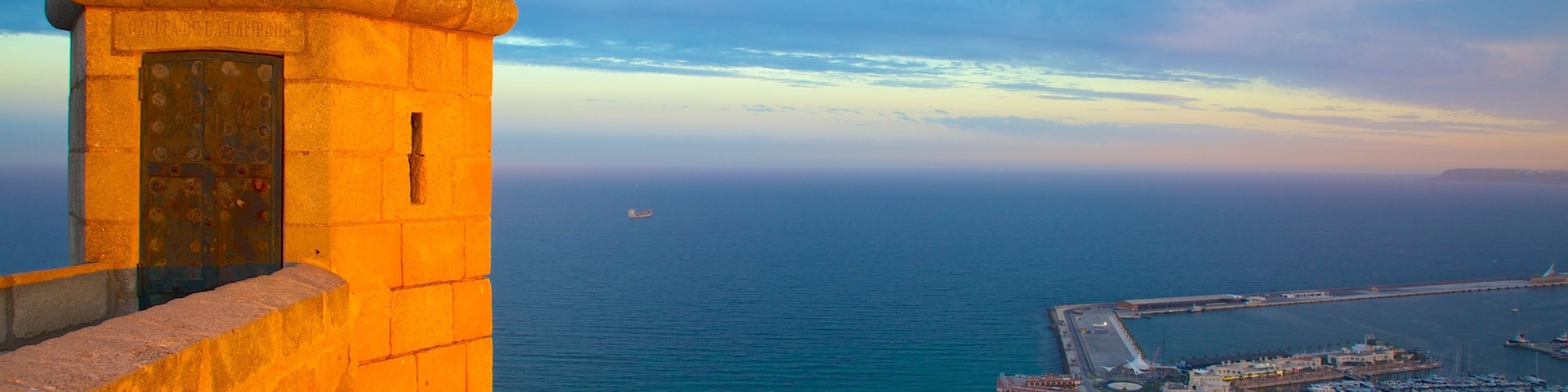Castle of Santa Barbara showing a marina, a sunset and general coastal views