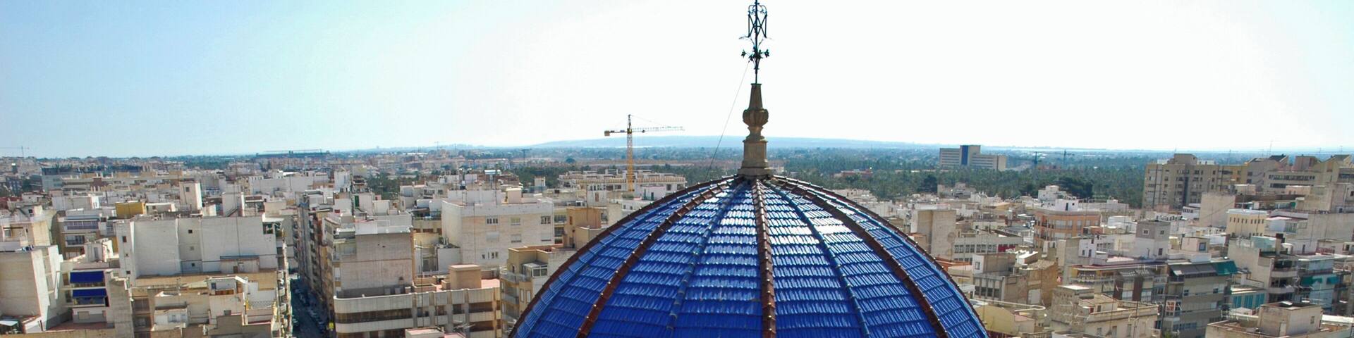 City scape with blue dome of the basilica Santa Maria, Elx, Elche, Spain