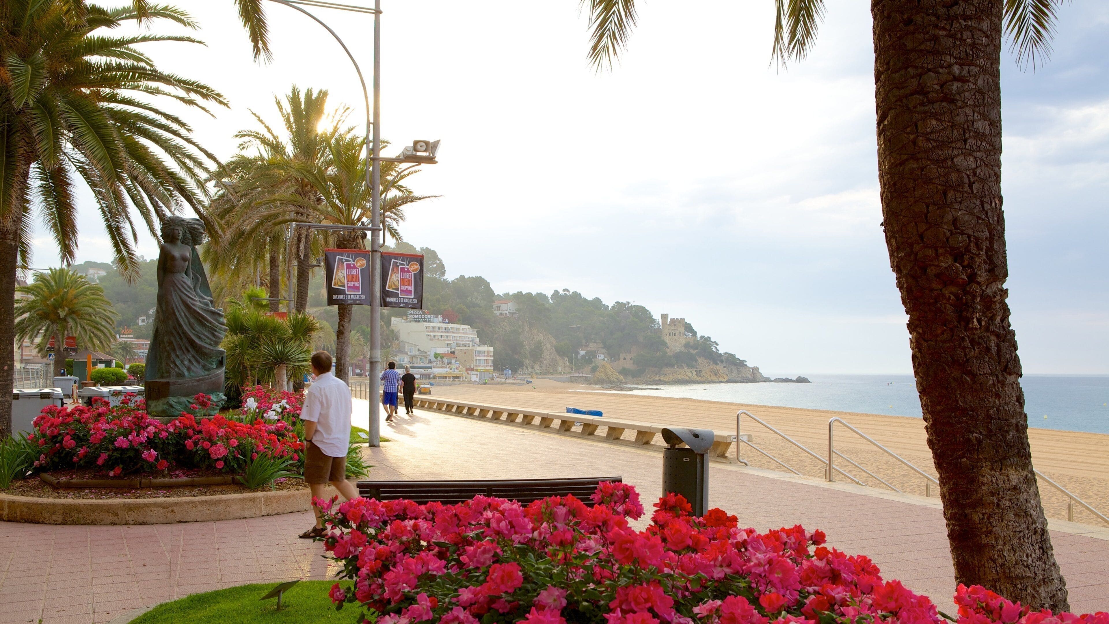 Lloret de Mar Beach showing flowers, general coastal views and street scenes