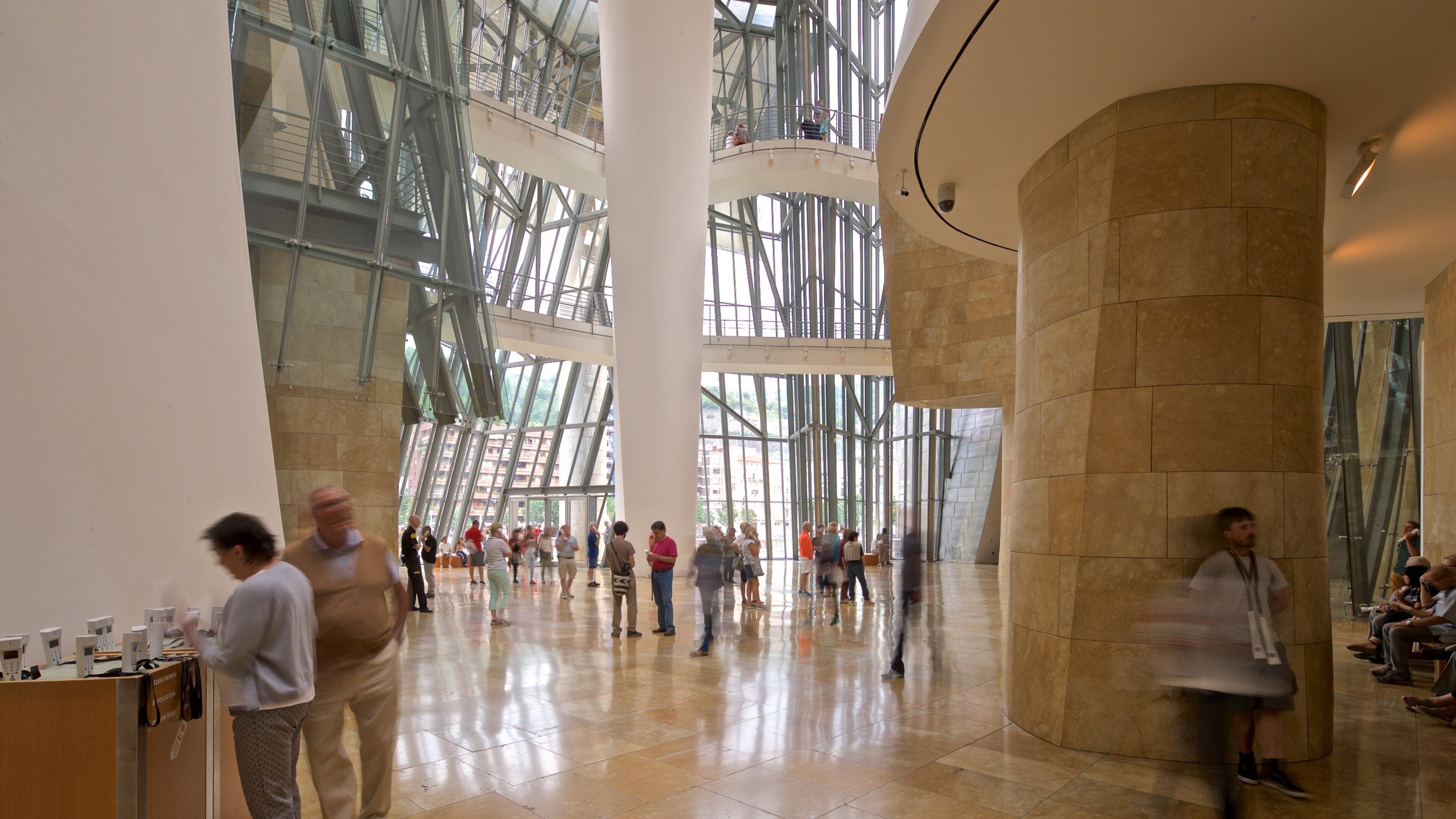 Guggenheim Museum Bilbao which includes interior views as well as a small group of people