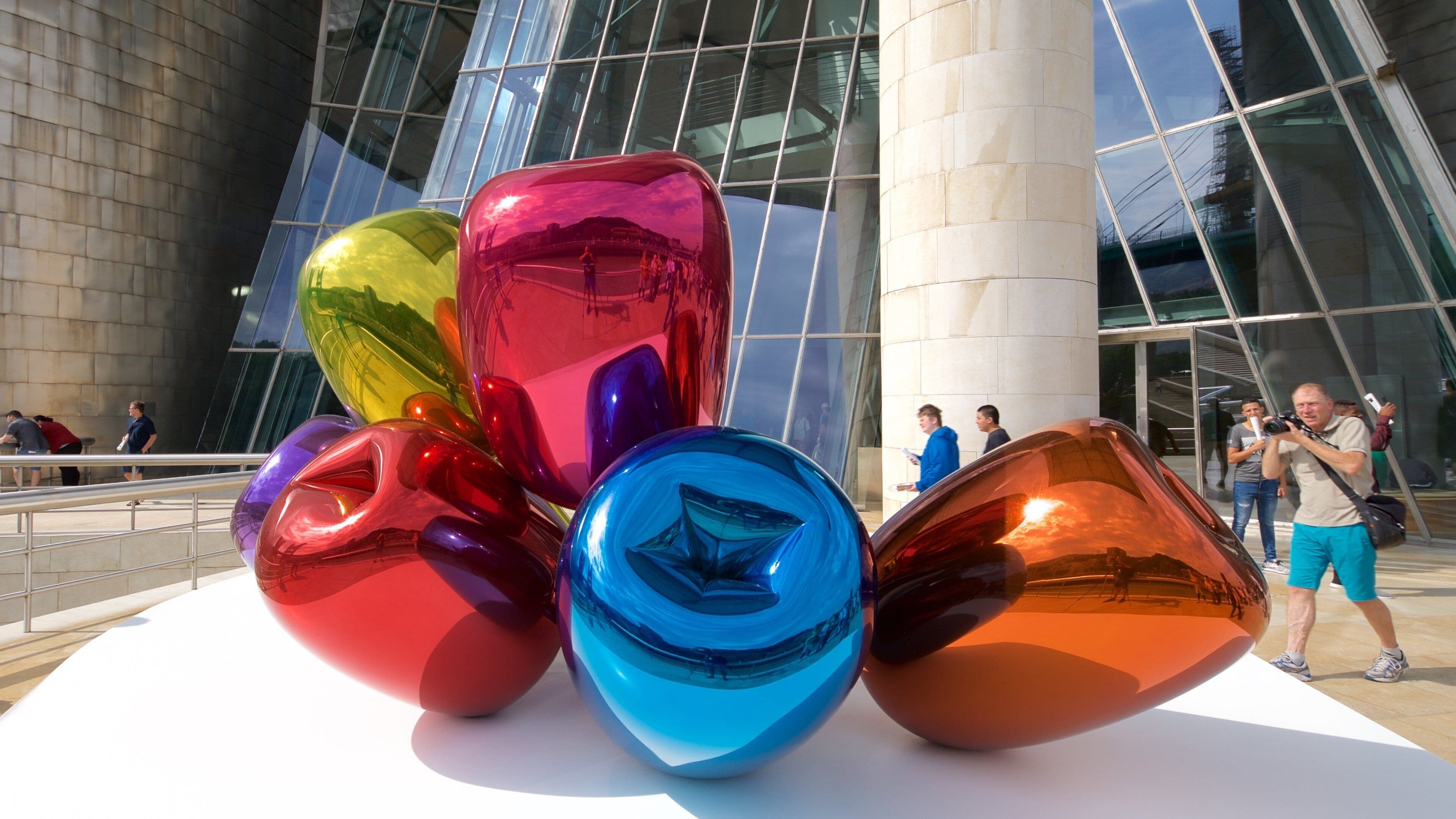 Guggenheim Museum Bilbao which includes outdoor art as well as a small group of people