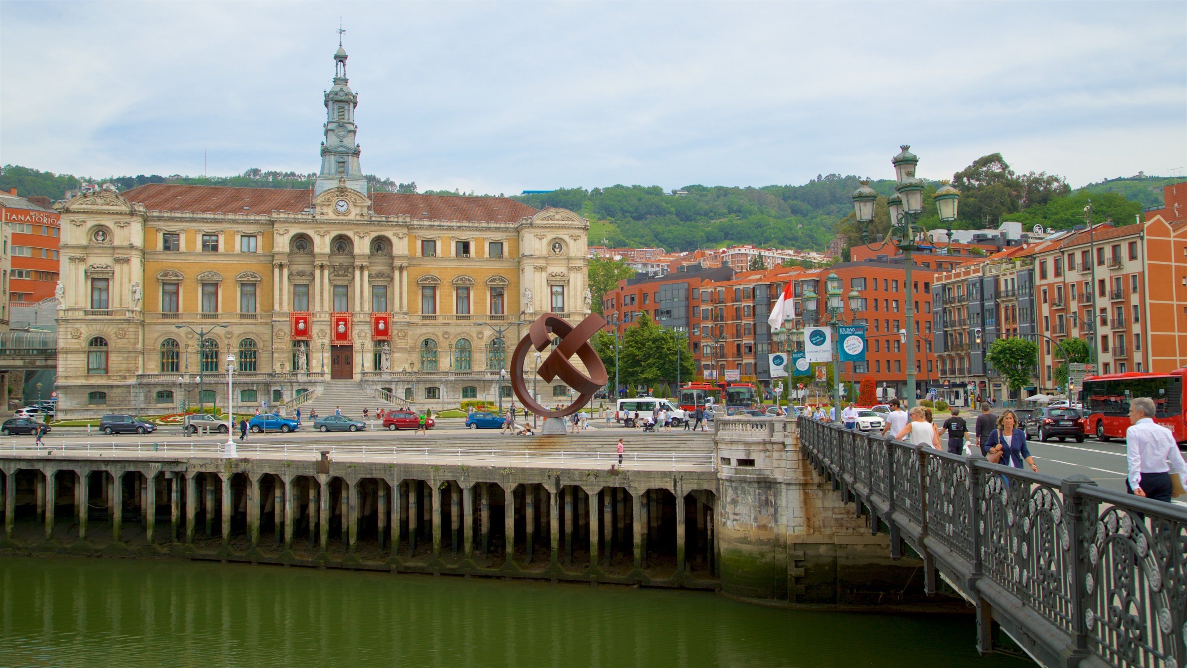 Bilbao City Hall which includes a city, heritage architecture and a river or creek
