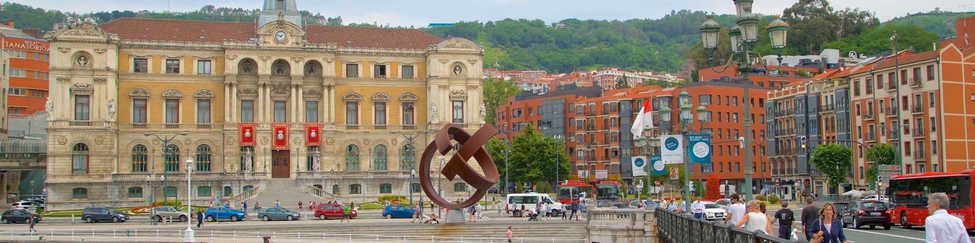 Bilbao City Hall which includes a city, heritage architecture and a river or creek