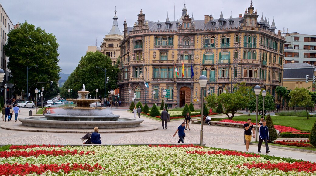 Plaza Moyua which includes a fountain, a park and heritage architecture