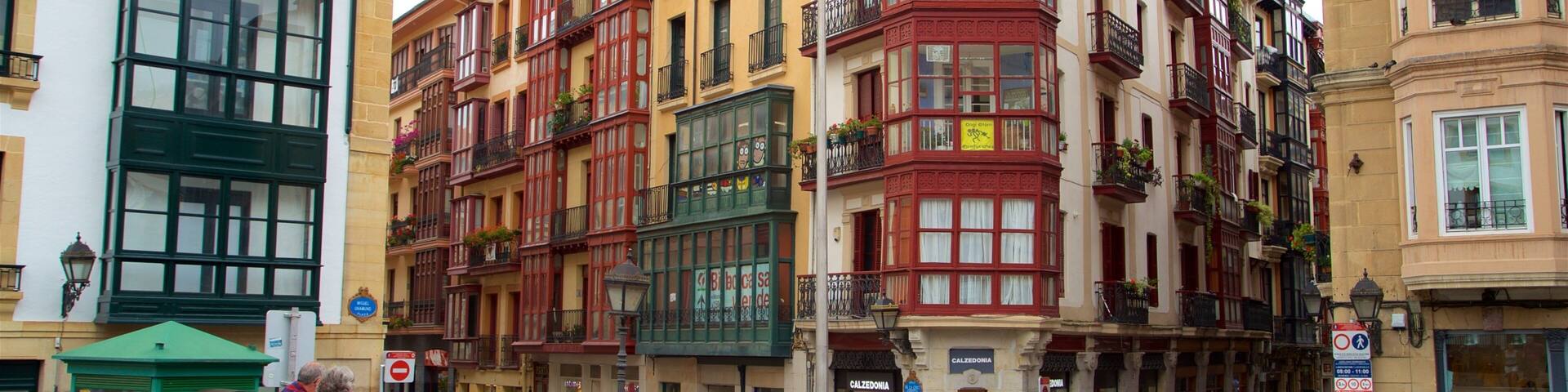 Plaza Miguel de Unamuno showing street scenes and a city as well as a small group of people