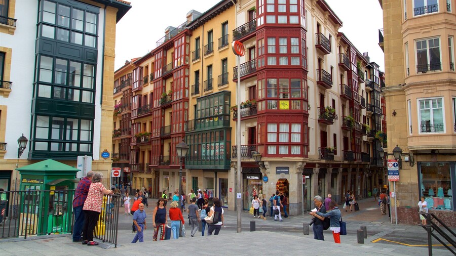Plaza Miguel de Unamuno featuring street scenes and a city as well as a small group of people