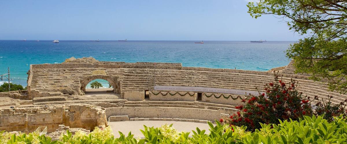 Tarragona Amphitheatre featuring general coastal views, rocky coastline and a ruin
