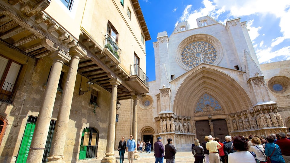 A historic building with a large rose window and Gothic architecture.
