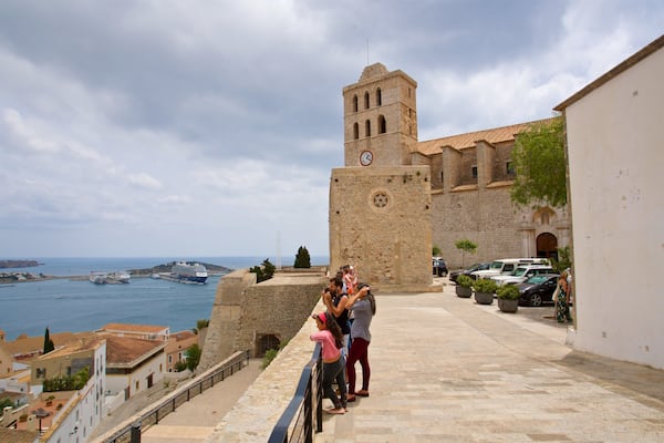 Ibiza Cathedral showing heritage elements and a bay or harbor as well as a family
