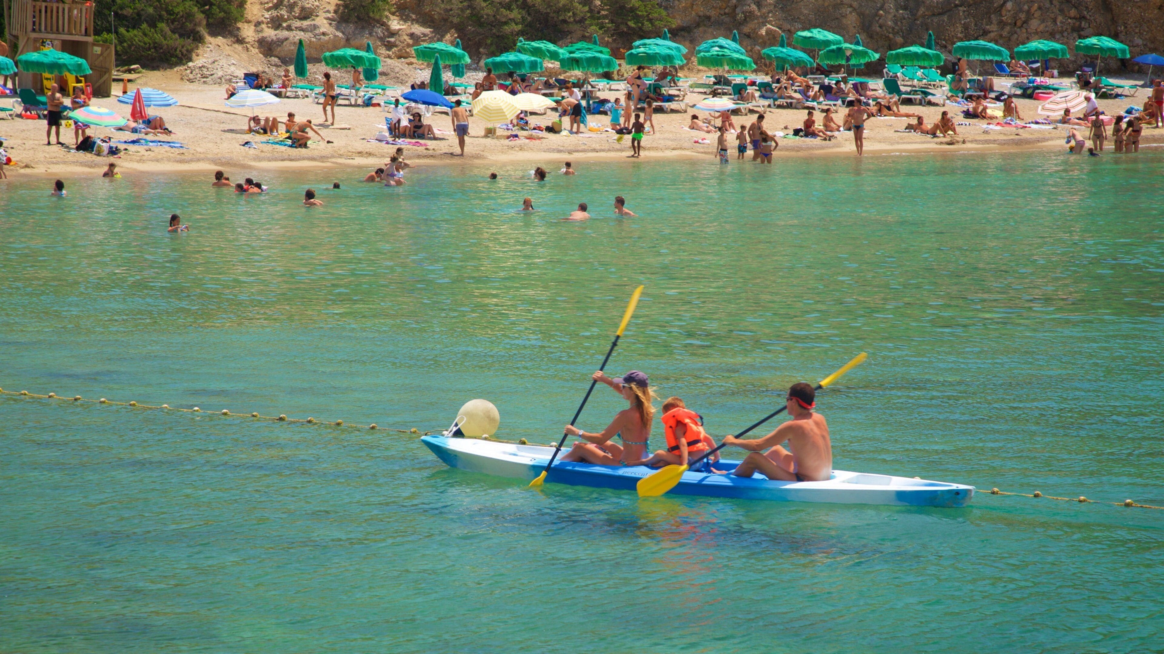 Benirras Beach which includes kayaking or canoeing and general coastal views as well as a family