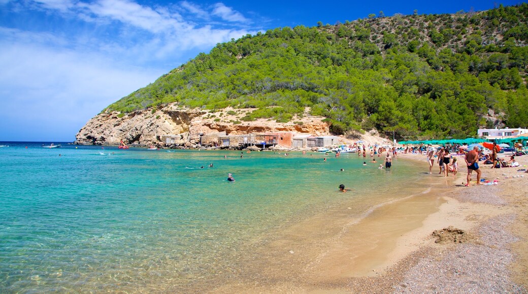 Benirras Beach featuring swimming, a coastal town and landscape views