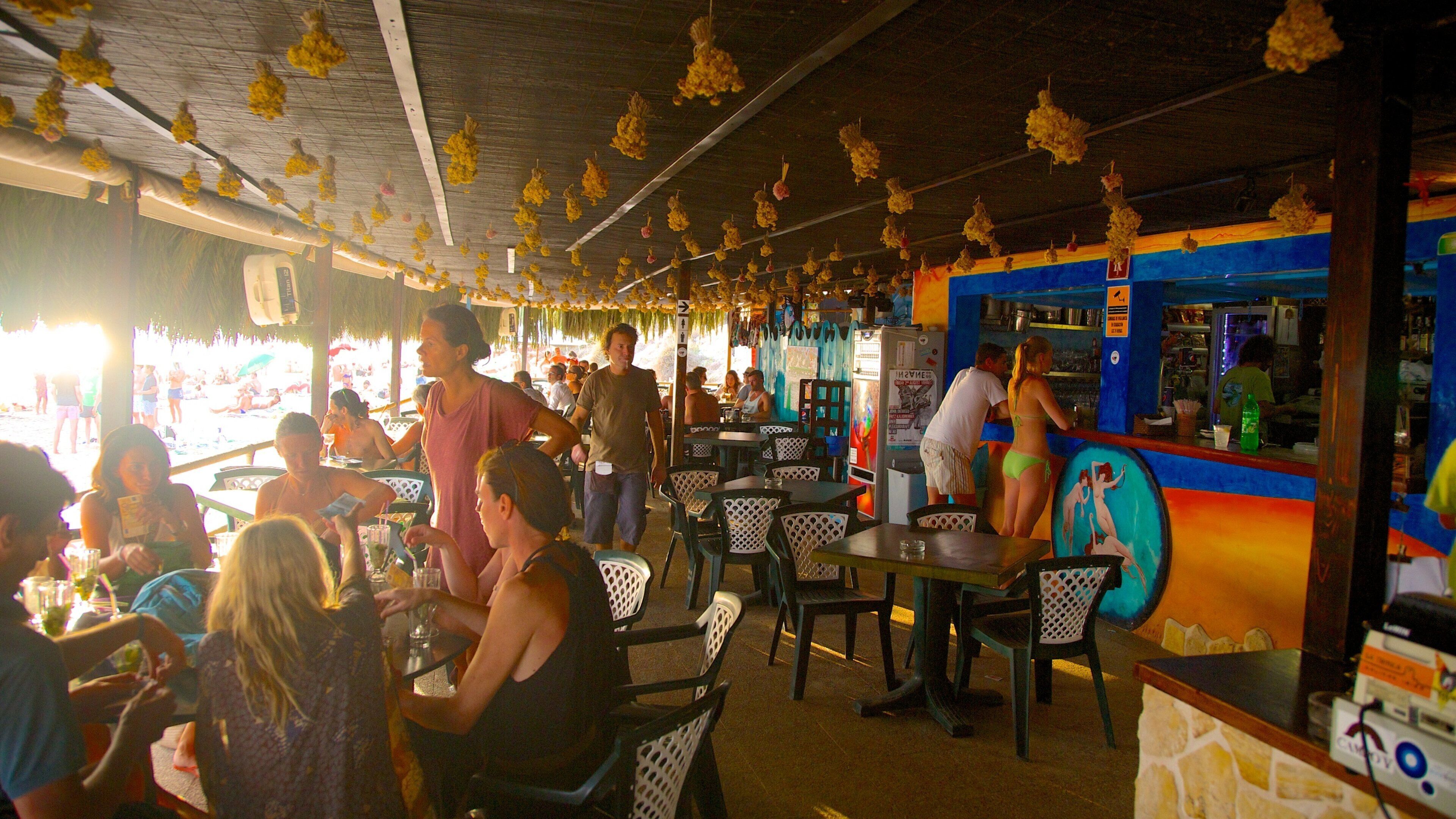Las Salinas Beach featuring street scenes, outdoor eating and interior views