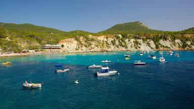 Cala d\'Hort Beach featuring landscape views, boating and a coastal town