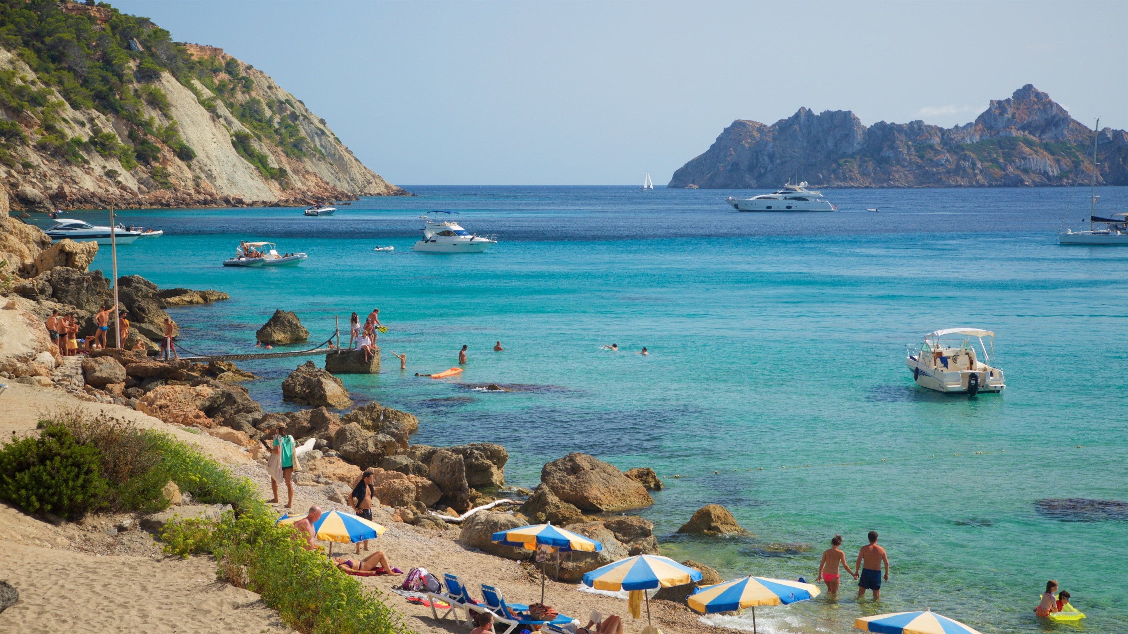Cala d\'Hort Beach featuring rugged coastline, general coastal views and a sandy beach