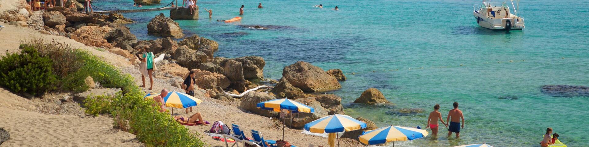Cala d\'Hort Beach featuring rugged coastline, general coastal views and a sandy beach