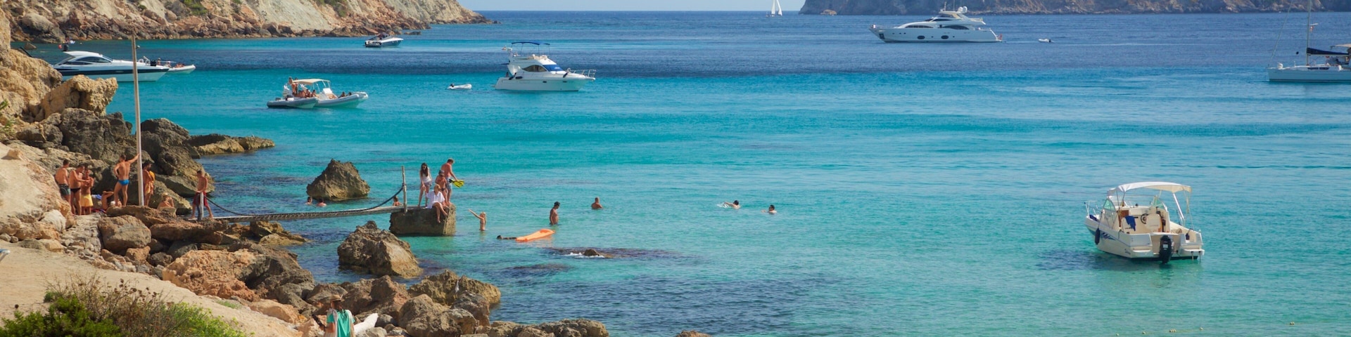 Cala d\'Hort Beach featuring rugged coastline, general coastal views and a sandy beach