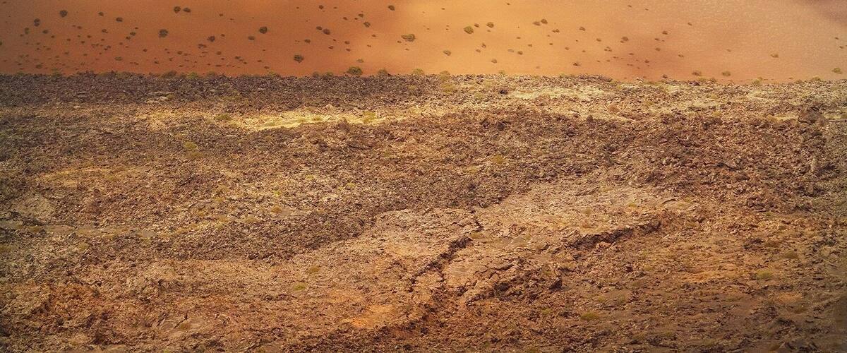 A landscape of volcanoes where reds and oranges blend from soil to sky and craters rest in their rugged forms. Timanfaya National Park is filled with volcanoes on the Spanish island of Lanzarote in the Canary Islands. For photographers it's a playground of opportunities!
To get this shot it's only possible on the tourist bus which takes regular drives around a one way route through the park. Be sure to have a fast shutter speed to avoid blue when taking shots from the bus window :)
#landscape