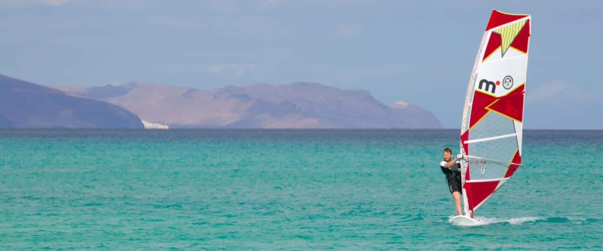 Sotavento de Jandia Beach featuring general coastal views and windsurfing as well as an individual male