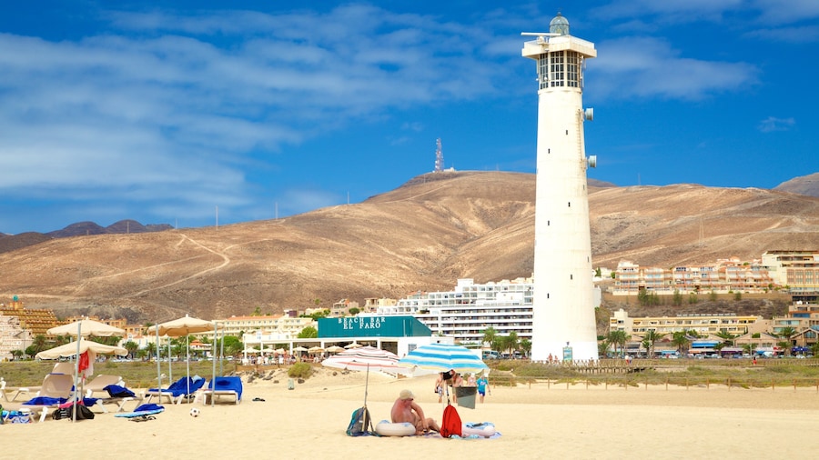 Punta Jandía Lighthouse featuring a coastal town and a lighthouse