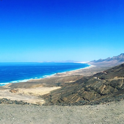Stunning beach which is a beautiful untouched area on the south west end of Fuertaventura. A fun off road (very good condition) to get to. Climbing through the volcanos you pop out over the top and see this view. There is a little cafe to stop at at the bottom in the village you can grab a drink. I would suggest taking a packed lunch and lots of sun cream. The waves are massive so be prepared but a fun swim and body surfing session. Enjoy.