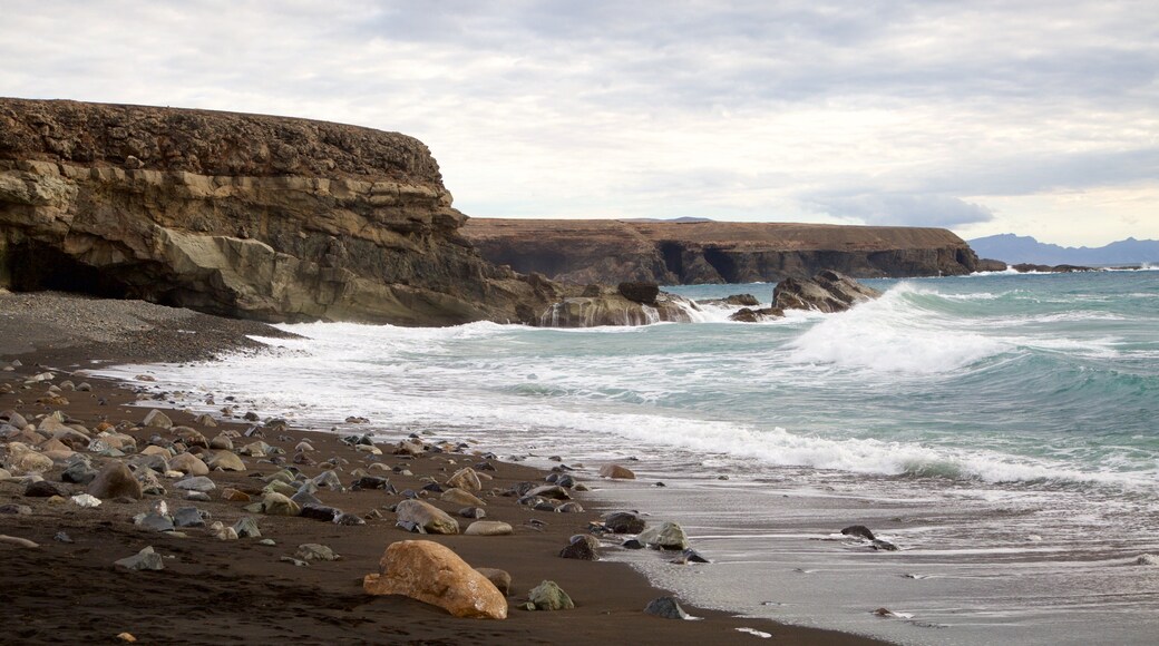 Ajuy Beach featuring rugged coastline, general coastal views and waves
