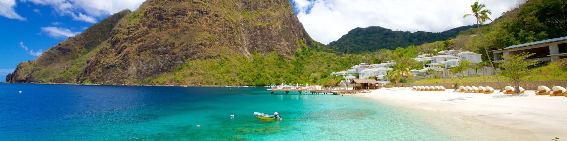 Jalousie Beach which includes mountains, a sandy beach and general coastal views