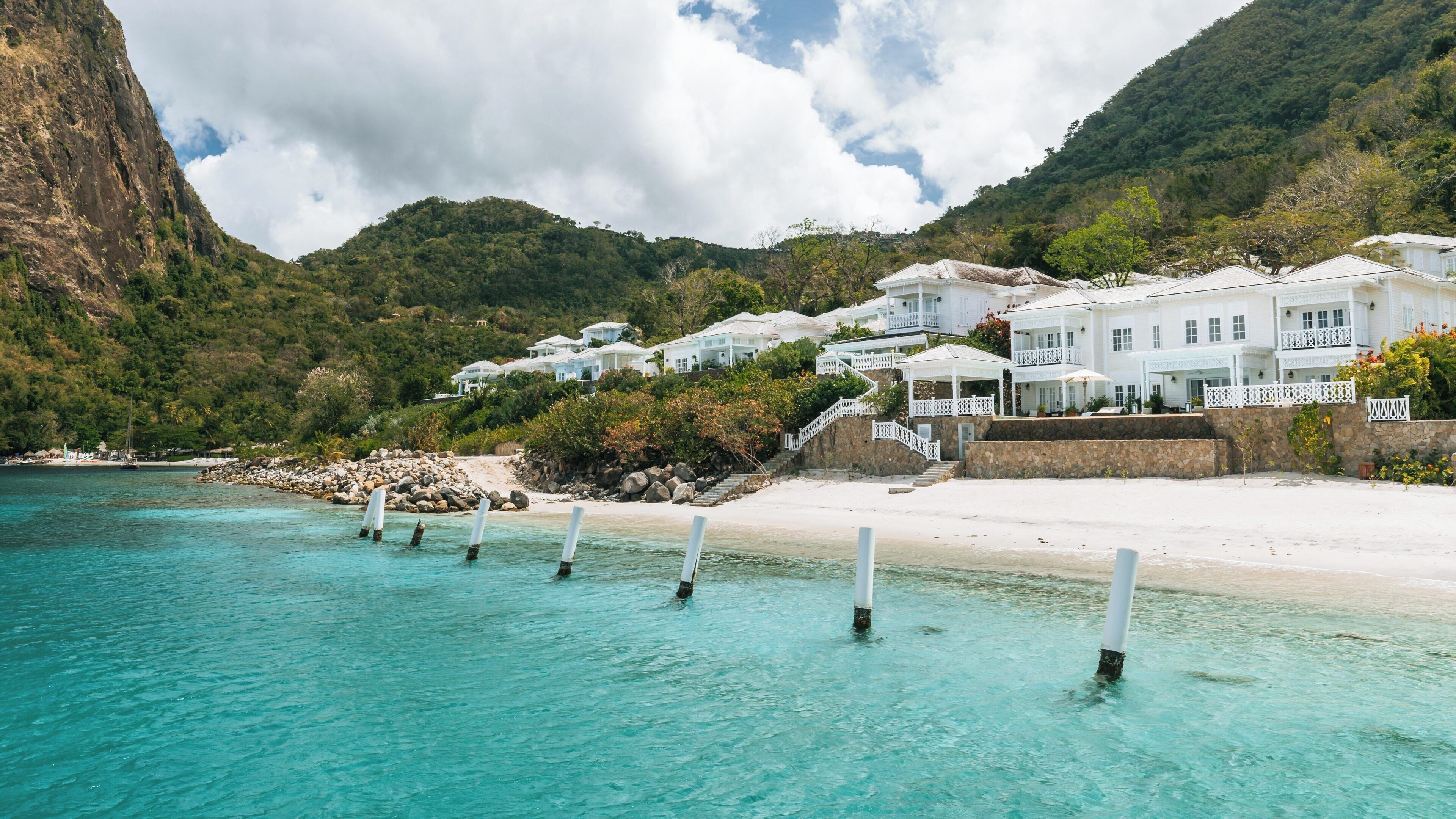 Stunning view of Jalousie Beach in Soufrière, St. Lucia showcasing clear turquoise waters and lush mountainous landscape