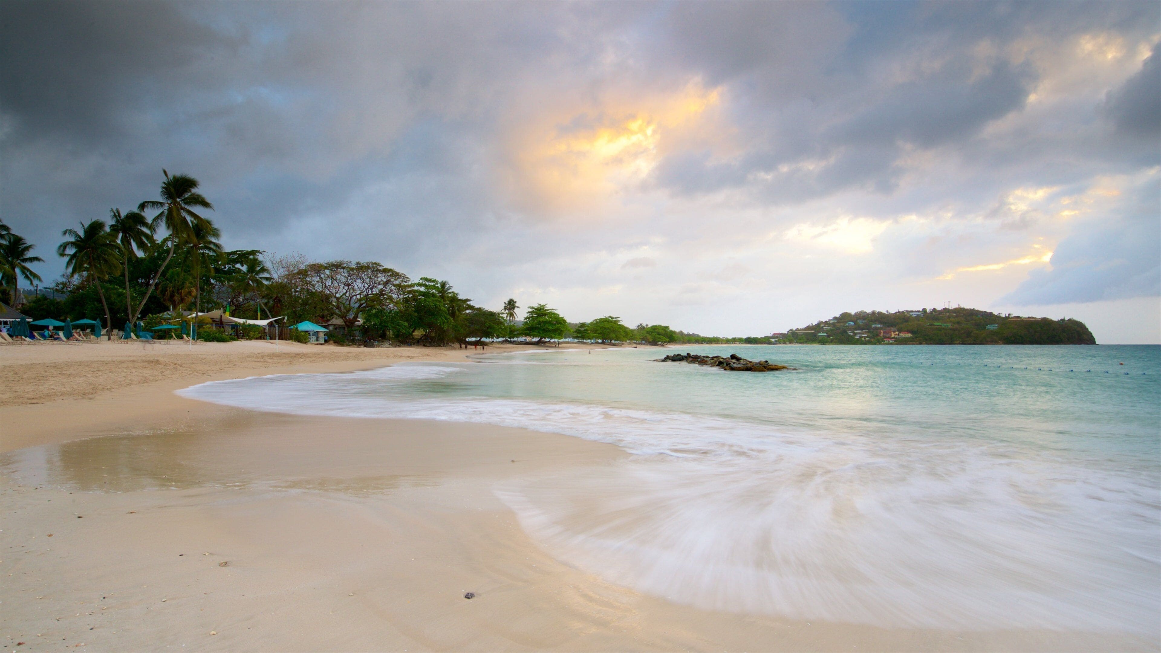 Vigie Beach showing a sunset, general coastal views and a sandy beach