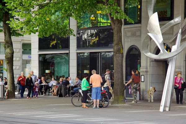 Paradeplatz showing cycling and street scenes as well as a large group of people