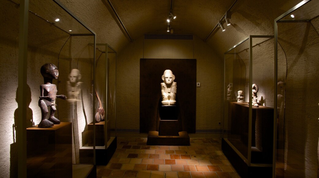 Barbier-Mueller Archeology Museum featuring a statue or sculpture and interior views