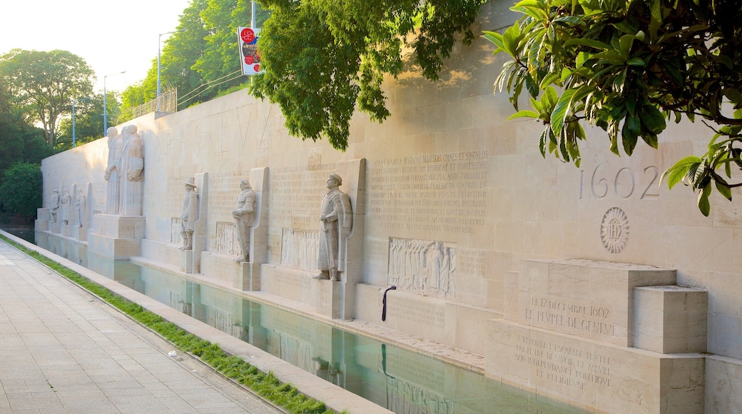 Reformation Wall Monument which includes a monument, a pond and a statue or sculpture