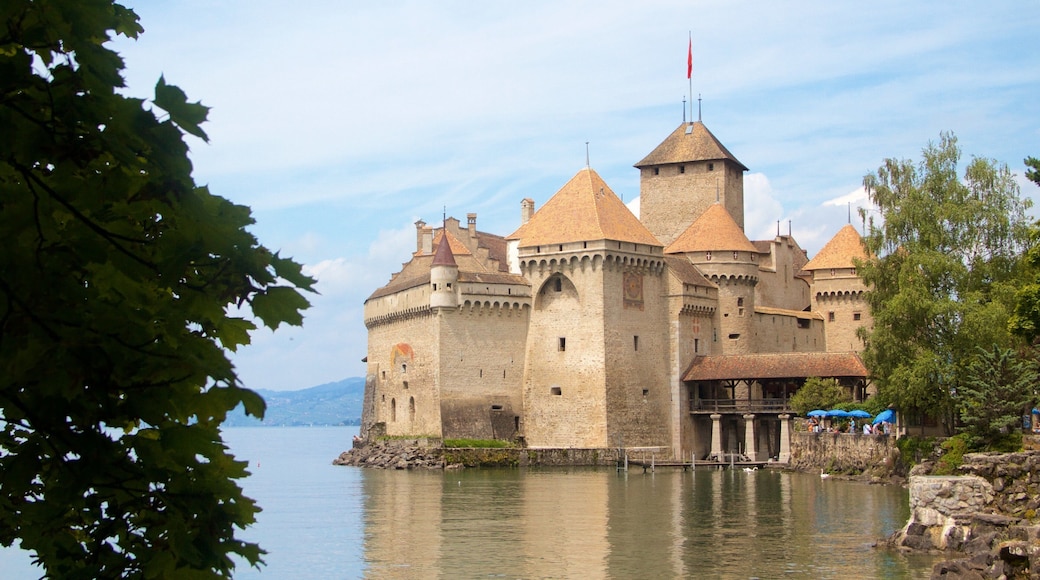 Chateau de Chillon showing heritage architecture, a lake or waterhole and chateau or palace