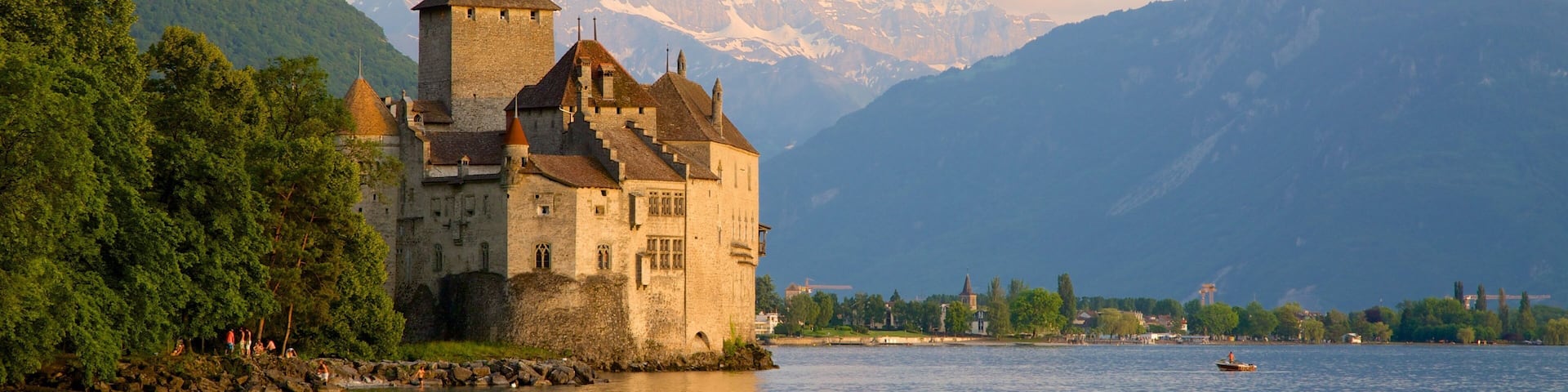 Chateau de Chillon featuring a lake or waterhole and a castle