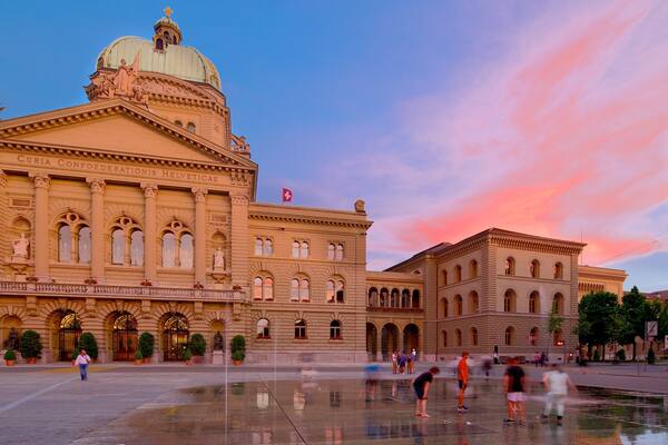 Bundeshaus showing a sunset, an administrative building and a square or plaza