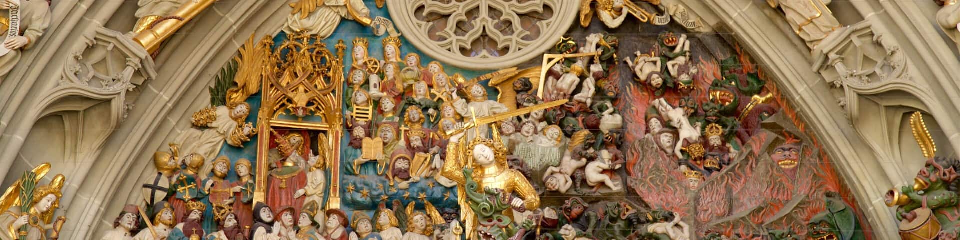 A detailed Gothic cathedral interior with ornate statues, a large rose window, and a depiction of the Last Judgment.