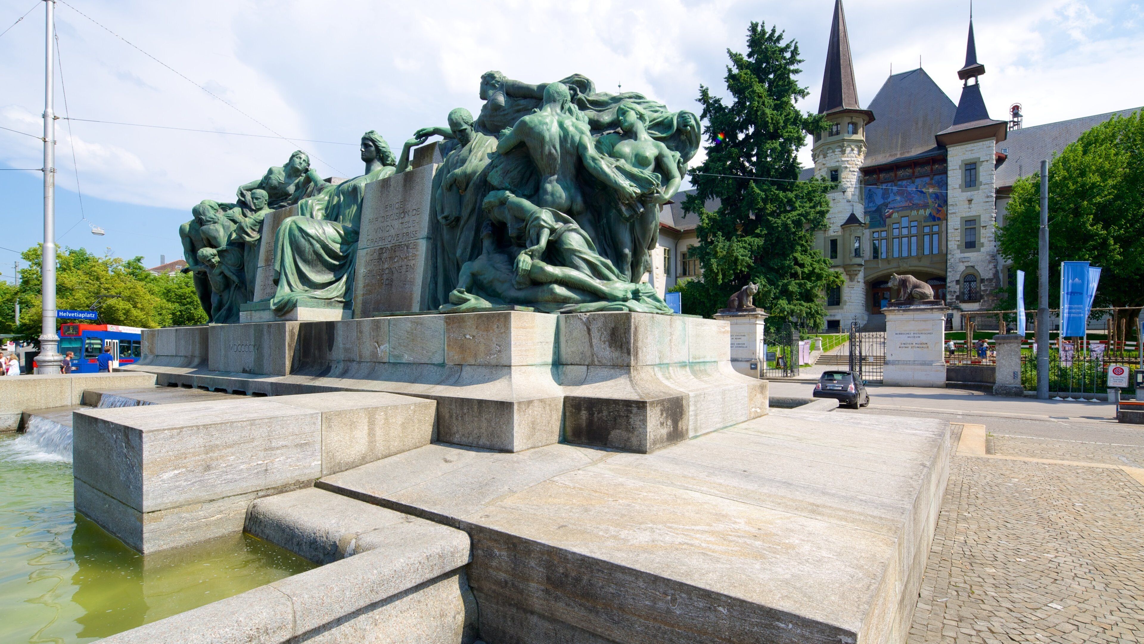 Bern Historical Museum featuring a statue or sculpture, outdoor art and a pond