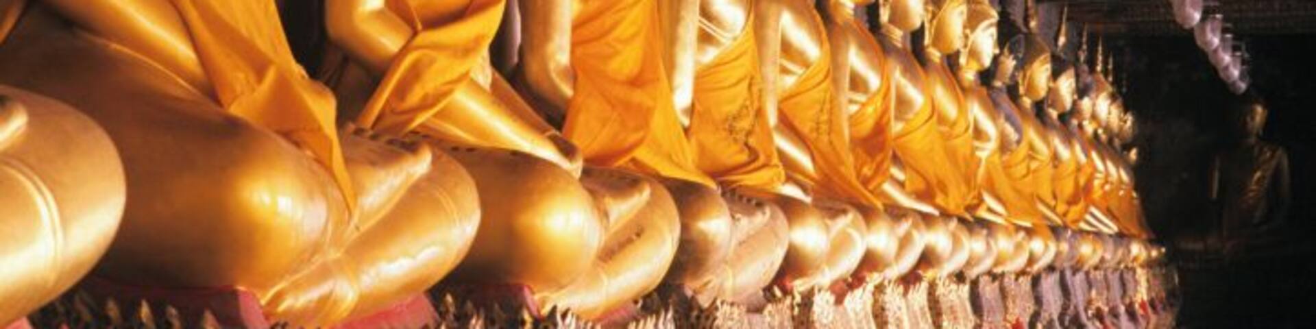 Thailand, Bangkok, Wat Suthat, Row of golden Buddha figurines