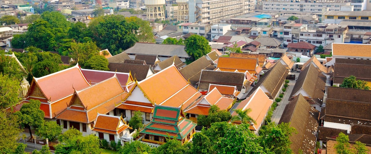 A cityscape with traditional buildings and modern skyscrapers.