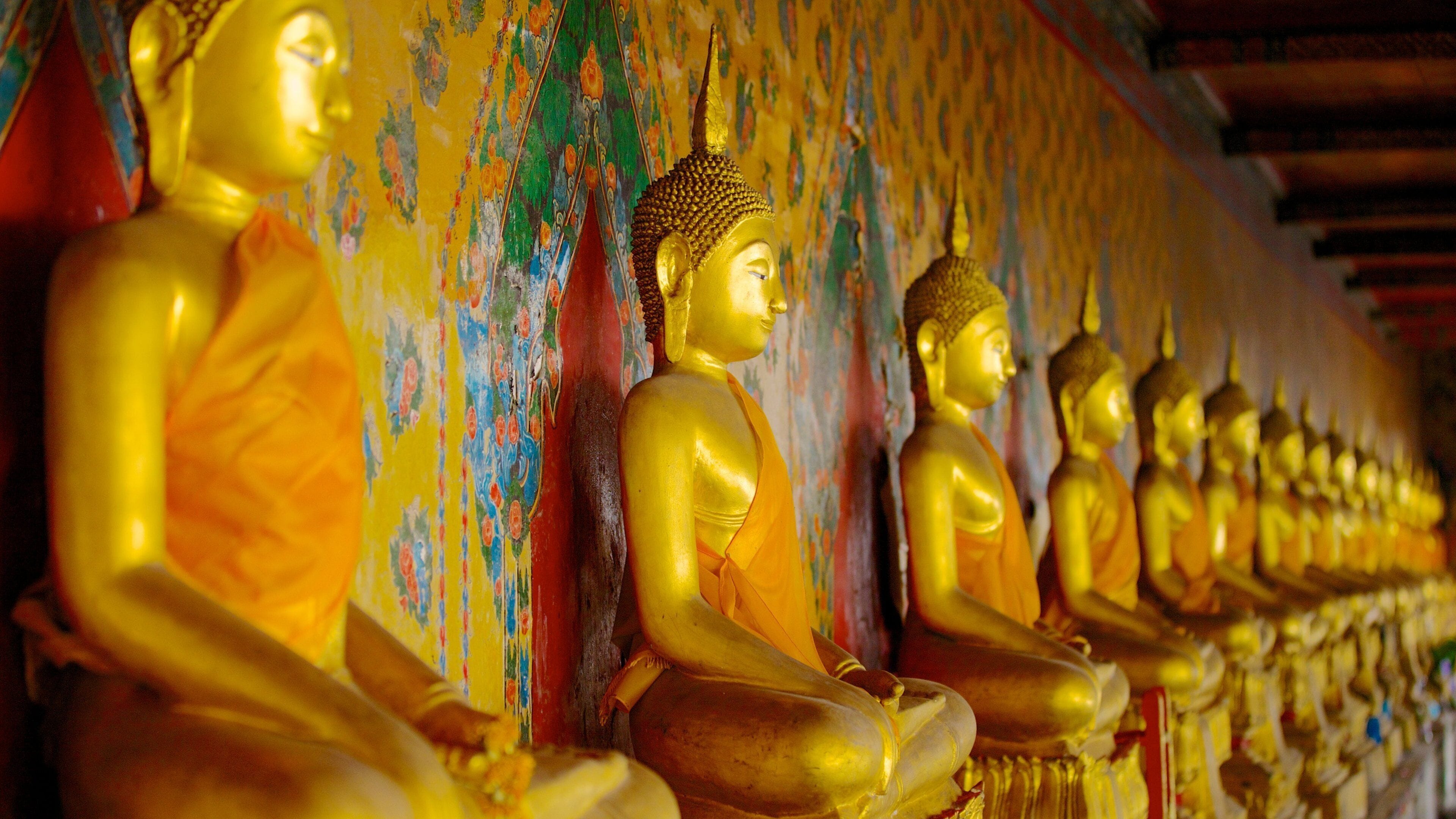 Wat Arun featuring religious elements and a statue or sculpture